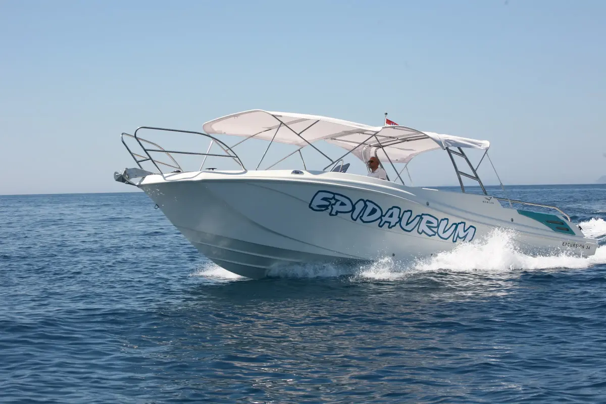 White Epidaurum speedboat cruising on calm water