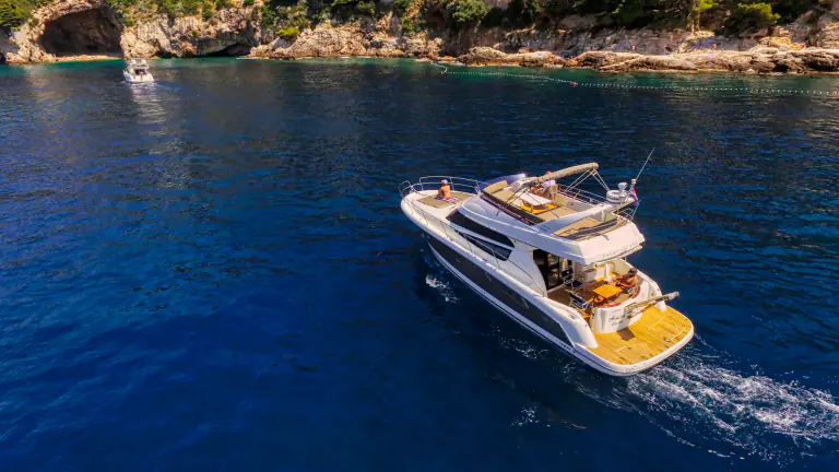 Amica on deep blue water seen from above