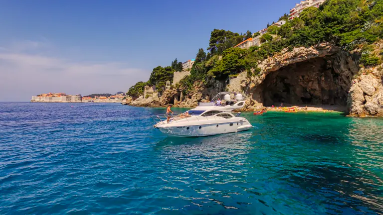 Azimut 43 Fly anchored by a sea cave near Dubrovnik