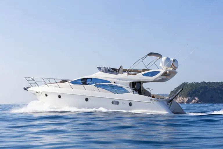 Azimut 43 Fly motor yacht under way near the coast