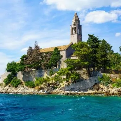 Island church and bell tower above the sea in the Elaphiti Islands