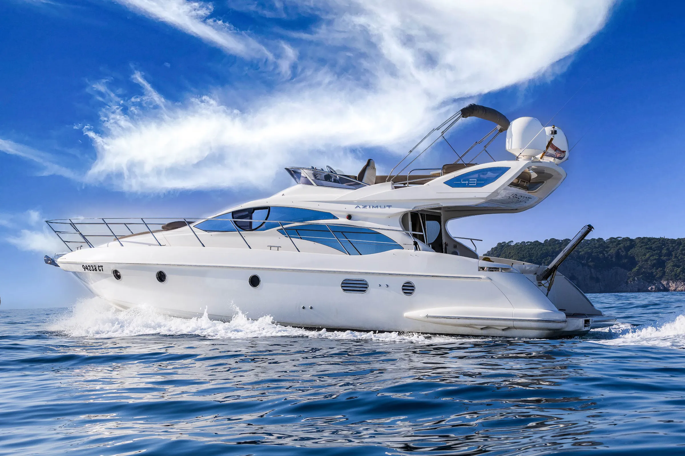 Azimut flybridge motor yacht at speed