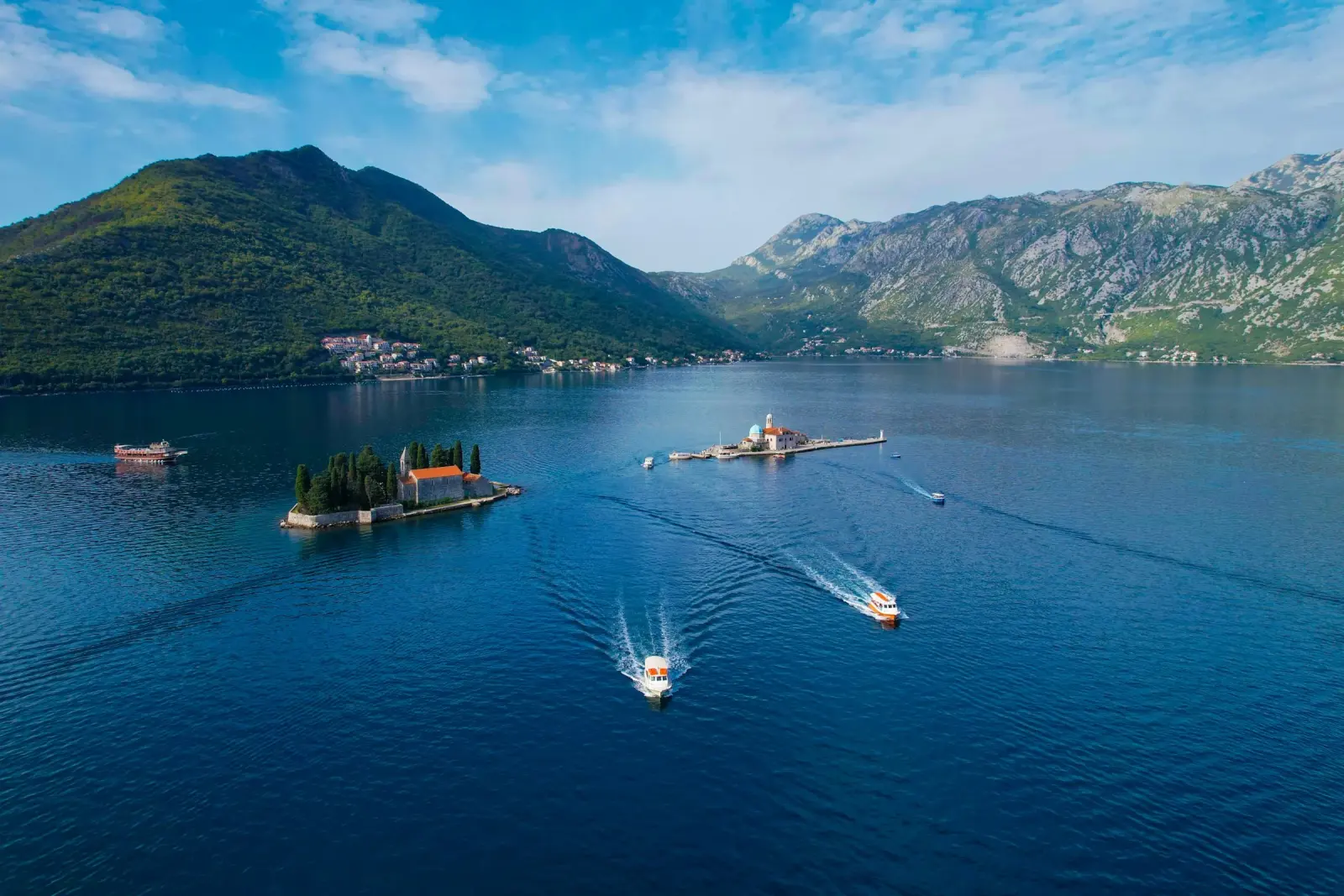 Both islets off Perast, boats heading out