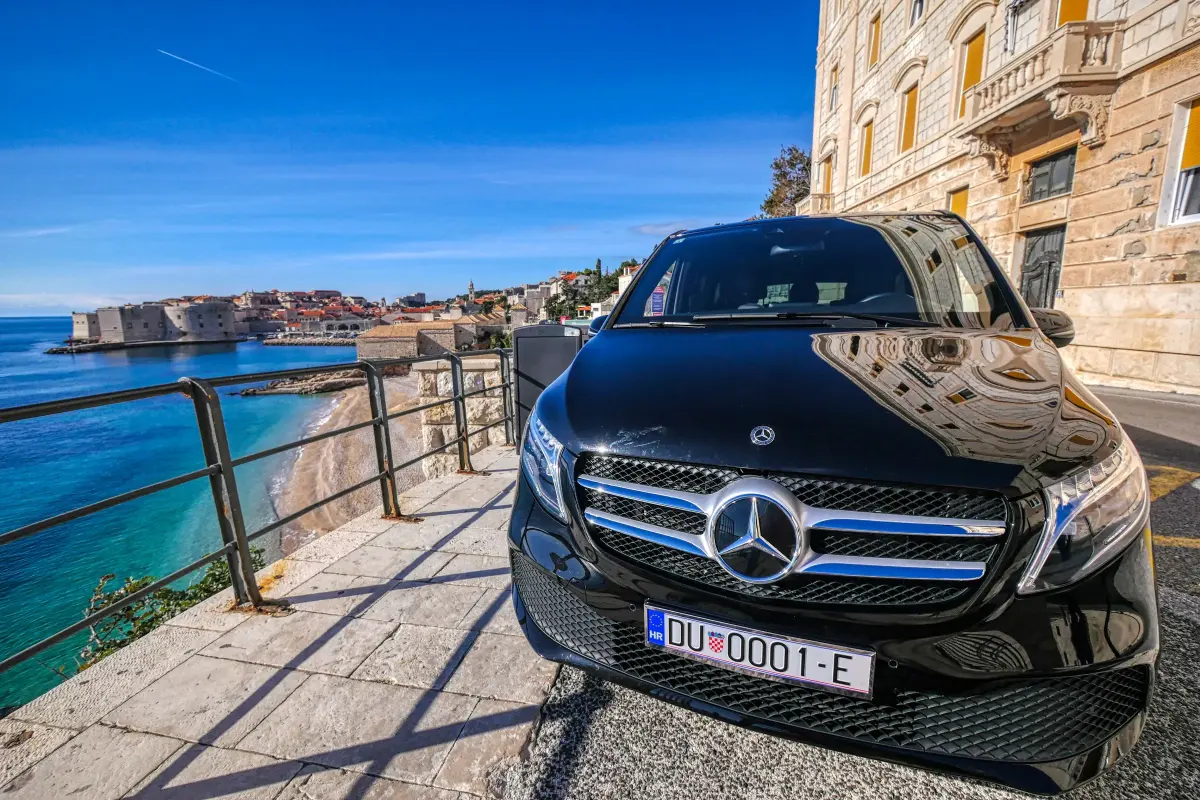Mercedes V-Class transfer car above the sea with Dubrovnik behind