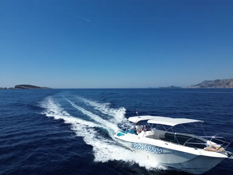 Excursion 34 speedboat from above on deep blue water