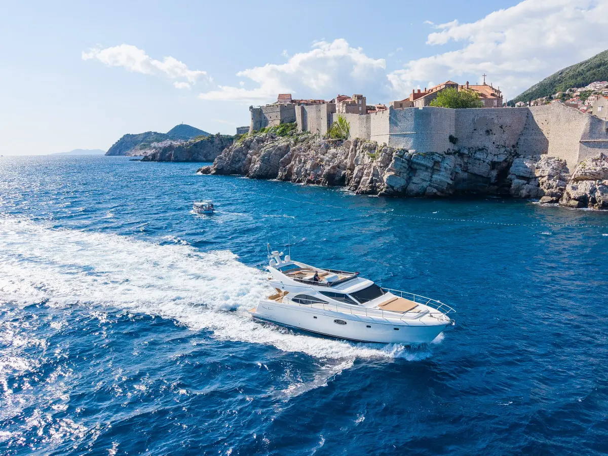 Ferretti 591 motor yacht passing Dubrovnik Old Town