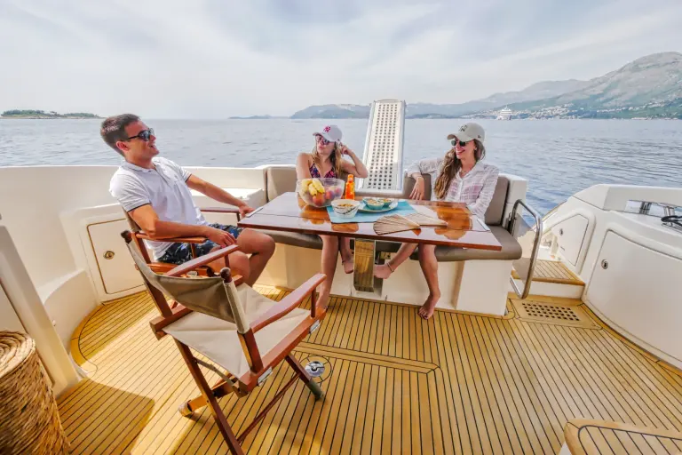 Guests toasting at the table on board