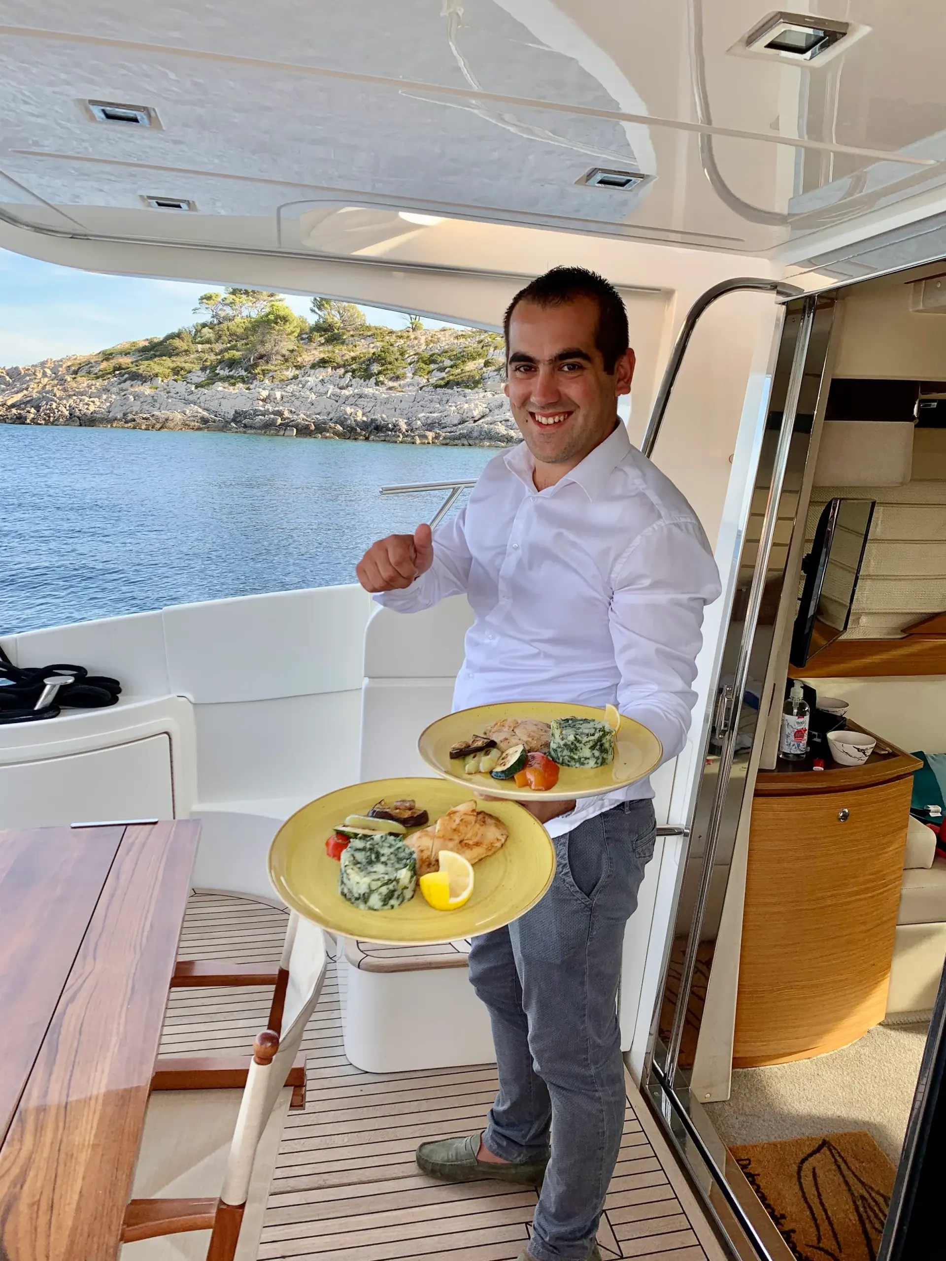Host serving a platter of food on board