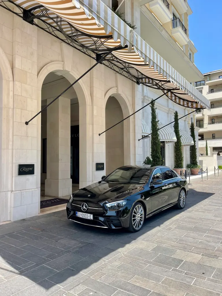 Mercedes waiting at a hotel entrance