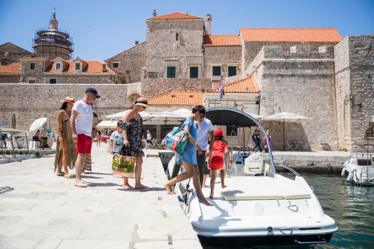 Guests boarding a speedboat at Dubrovnik's Old Port pier