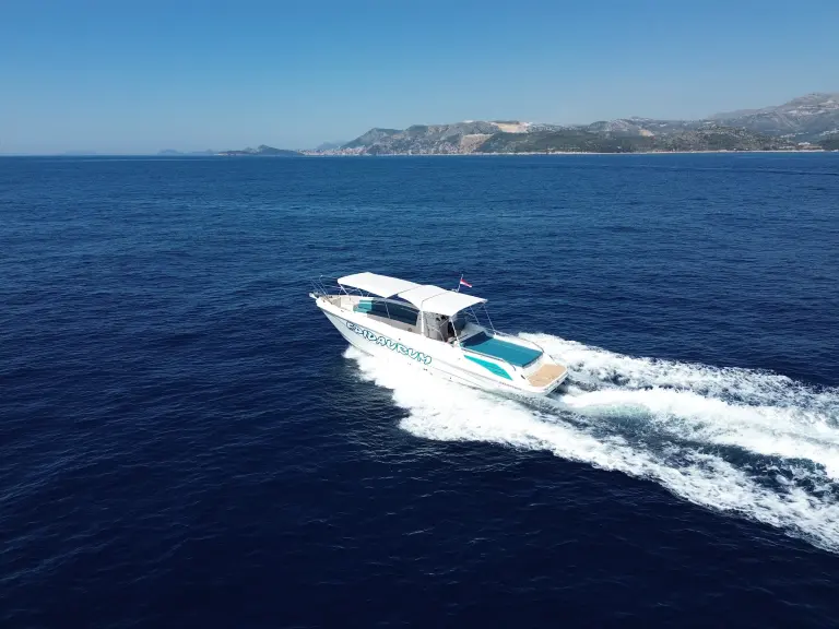 Open speedboat heading out across the sea