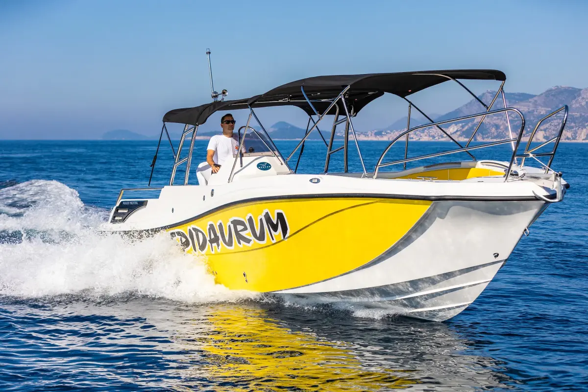 Epidaurum speedboat with a sun canopy cruising at speed