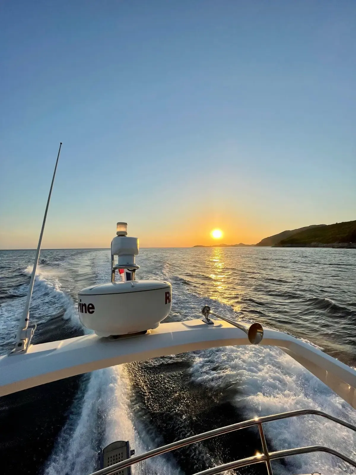 Sunset from the bow of a yacht under way
